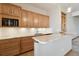 Basement kitchenette with granite countertops and wood cabinets at 38911 E Wesley Ave, Bennett, CO 80102