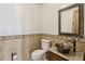 Powder room with copper sink and decorative mirror at 38911 E Wesley Ave, Bennett, CO 80102