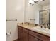 Bathroom with granite countertop, large mirror, and shower at 38911 E Wesley Ave, Bennett, CO 80102