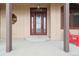 Home entrance with a charming red door at 38911 E Wesley Ave, Bennett, CO 80102