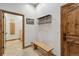 Inviting entryway with a bench and coat rack at 38911 E Wesley Ave, Bennett, CO 80102