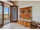 Bright entryway with tiled floors and antique bench at 38911 E Wesley Ave, Bennett, CO 80102