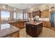 Gourmet kitchen with granite countertops and large island at 38911 E Wesley Ave, Bennett, CO 80102