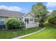 Outdoor space featuring a patio, well-maintained lawn, and lush, mature landscaping at 6626 S Reed Way # A, Littleton, CO 80123