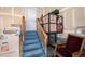 Basement access staircase with lift and storage space at 6626 S Reed Way # A, Littleton, CO 80123