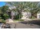 Charming home featuring stone accents, a well-maintained yard, and a two-car garage at 6626 S Reed Way # A, Littleton, CO 80123