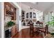 Dining area with hardwood floors, wine bar and open floor plan at 73 Falcon Hills Dr, Highlands Ranch, CO 80126