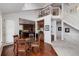 Open floor plan of dining area with hardwood floors and second story view at 73 Falcon Hills Dr, Highlands Ranch, CO 80126