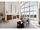 Spacious living room with high ceilings, fireplace, and scenic views at 73 Falcon Hills Dr, Highlands Ranch, CO 80126