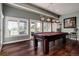 Bright billiards room featuring large windows, stylish lighting and a classic pool table for game night at 73 Falcon Hills Dr, Highlands Ranch, CO 80126