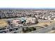 Aerial view of a local school featuring playgrounds and parking, nestled within a residential community at 5436 S Versailles Way, Aurora, CO 80015