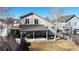 This backyard features a covered patio with an outdoor kitchen and comfortable seating to entertain at 5436 S Versailles Way, Aurora, CO 80015