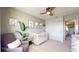 This charming bedroom features a modern ceiling fan and a stylish closet with ample storage at 5436 S Versailles Way, Aurora, CO 80015