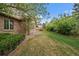 Expansive lawn and mature trees create a serene backyard setting at 7914 S Clayton Cir, Centennial, CO 80122