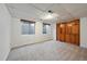 Finished basement area features carpeted floors, natural light from windows and closet for storage at 7914 S Clayton Cir, Centennial, CO 80122