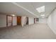 Spacious finished basement area with neutral carpeting, ample lighting, and potential for various uses at 7914 S Clayton Cir, Centennial, CO 80122