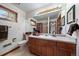 Bathroom with wood cabinets and a large mirror at 7914 S Clayton Cir, Centennial, CO 80122