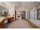 Bright bathroom with a vanity, shower, and bathtub at 7914 S Clayton Cir, Centennial, CO 80122