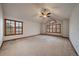 Bright, spacious bedroom with carpet flooring and large windows offering ample natural light at 7914 S Clayton Cir, Centennial, CO 80122
