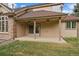 Back patio boasts ceiling fans for comfort & access to backyard at 7914 S Clayton Cir, Centennial, CO 80122