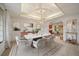 Elegant dining room with tray ceiling, modern chandelier, and stylish seating for six at 7914 S Clayton Cir, Centennial, CO 80122