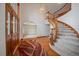 Welcoming foyer with a grand staircase and beautiful hardwood floors at 7914 S Clayton Cir, Centennial, CO 80122