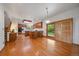 Bright kitchen with wood cabinets, island seating, and sliding doors to the yard at 7914 S Clayton Cir, Centennial, CO 80122