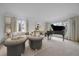 Bright living room with neutral colors, large windows, and comfortable seating at 7914 S Clayton Cir, Centennial, CO 80122
