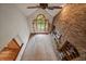Spacious living room with a vaulted ceiling, brick fireplace, and large windows at 7914 S Clayton Cir, Centennial, CO 80122