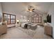 Spacious main bedroom with vaulted ceiling, ceiling fan, and abundant natural light at 7914 S Clayton Cir, Centennial, CO 80122
