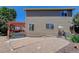 Back of house includes a stone paver area, gravel and a covered deck at 1446 Braewood Ave, Highlands Ranch, CO 80129