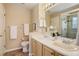 Well-lit bathroom with double sinks, updated fixtures, and a serene atmosphere for your daily routines at 1446 Braewood Ave, Highlands Ranch, CO 80129