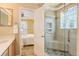 Stylish bathroom with a glass-enclosed shower, stone features, and seamless access to the bedroom at 1446 Braewood Ave, Highlands Ranch, CO 80129