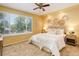 Bright bedroom featuring a large window, natural decor, and a plush bed for a relaxing retreat at 1446 Braewood Ave, Highlands Ranch, CO 80129