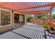 Spacious deck with overhead pergola perfect for outdoor entertaining at 1446 Braewood Ave, Highlands Ranch, CO 80129
