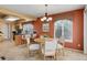 Inviting dining area features a round table, stylish chairs, and natural light from the adjacent kitchen and windows at 1446 Braewood Ave, Highlands Ranch, CO 80129