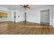 Spacious living room with hardwood floors, white walls and ceiling fan at 1051 Lima St, Aurora, CO 80010