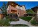 Back of red brick home with inviting outdoor spaces and lush landscaping at 286 S Gilpin St, Denver, CO 80209