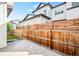 Cozy backyard area featuring concrete patio, privacy fence and rock landscaping at 9700 E 63Rd Pl, Denver, CO 80238