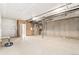 Unfinished basement ready for customization with concrete floors and exposed ceiling pipes and mechanicals at 9700 E 63Rd Pl, Denver, CO 80238