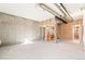 Unfinished basement with exposed concrete walls and framing, ready for customization at 9700 E 63Rd Pl, Denver, CO 80238