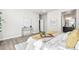 Stylish bedroom with decorative wall art, bedside table, and en-suite bathroom at 9700 E 63Rd Pl, Denver, CO 80238