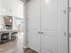Hallway view into kitchen with island and barstools at 9700 E 63Rd Pl, Denver, CO 80238