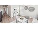 Bright and airy living room with modern decor, wood-look floors, and a comfortable seating area creating a welcoming space at 9700 E 63Rd Pl, Denver, CO 80238