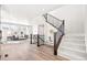 Bright living room showcasing a modern staircase, open-concept design, and stylish decor with an inviting atmosphere at 9700 E 63Rd Pl, Denver, CO 80238