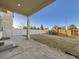 Covered patio leads to a backyard with a playset and a well-maintained fence, perfect for Gathering enjoyment at 18241 E 47Th Dr, Denver, CO 80249