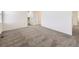 Spacious bedroom featuring plush carpeting and multiple doorways at 18241 E 47Th Dr, Denver, CO 80249