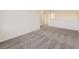 Spacious bonus room with neutral carpet adjacent to a hallway showcasing the home's open layout at 18241 E 47Th Dr, Denver, CO 80249