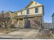 Inviting two-story home with stone accents, neutral siding, and an attached two-car garage at 18241 E 47Th Dr, Denver, CO 80249