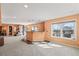 Spacious finished basement area with a bar, large windows, and neutral carpet at 1929 Baguette Dr, Castle Rock, CO 80108